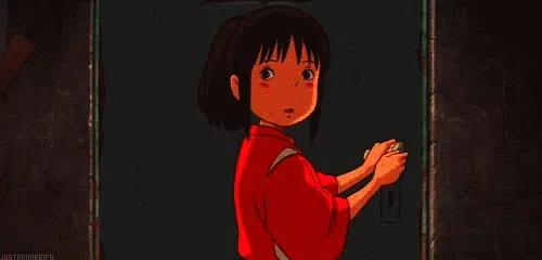 Animated gif of Chihiro from Spirited Away in a red tunic pausing at a dark doorway