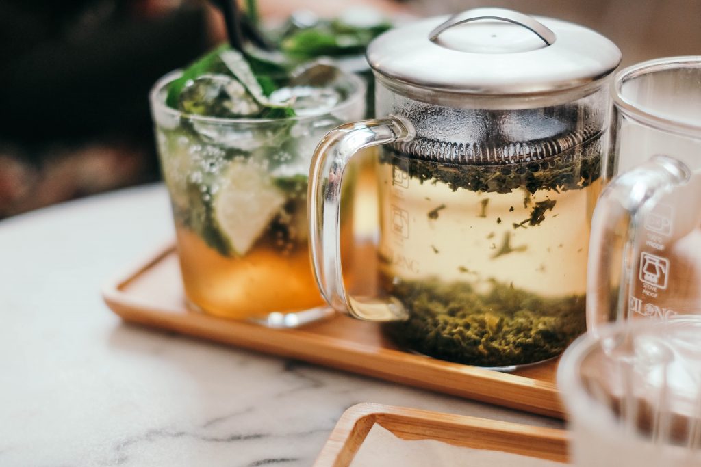 tea being brewed in a french press cup