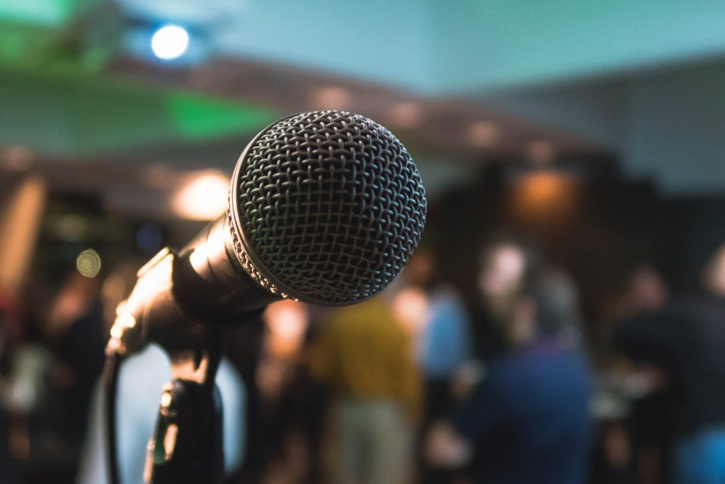 microphone in front of a blurred crowd